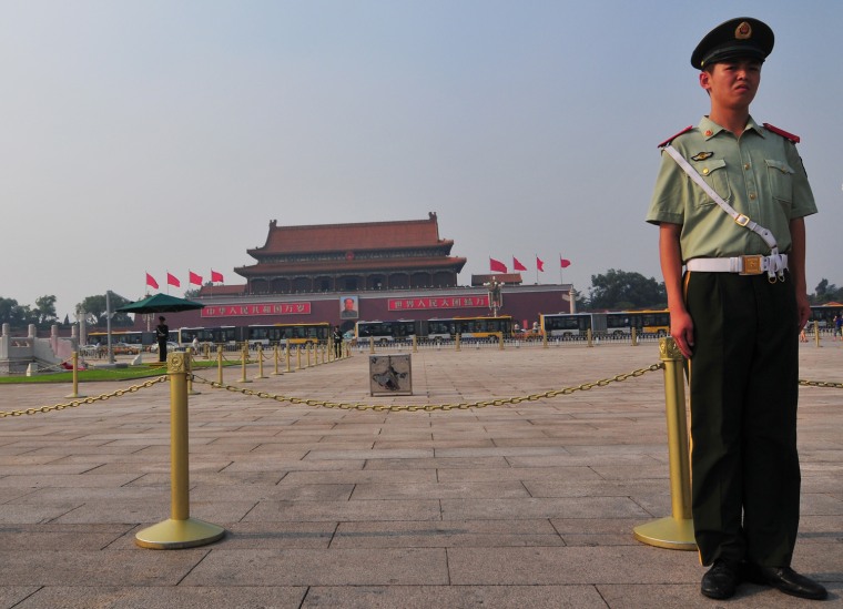 A soldier stands guard in Tiananmen Square. Like local police, he carries no weapons.